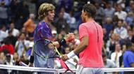 Rafael Nadal (R) and Andrey Rublev greet each other at the net following their 2017 US Open match